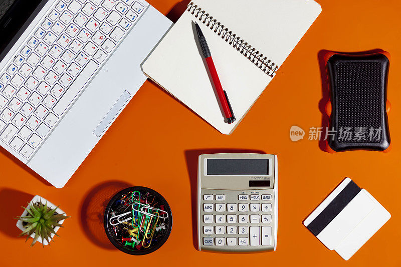 Items for business and accounting on a bright, colored background.